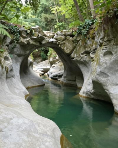 AI-generated illustration of Krčnik and Kotline, a natural water-polished stone arch over a creek with sculpted potholes and green pools in Goriška Brda