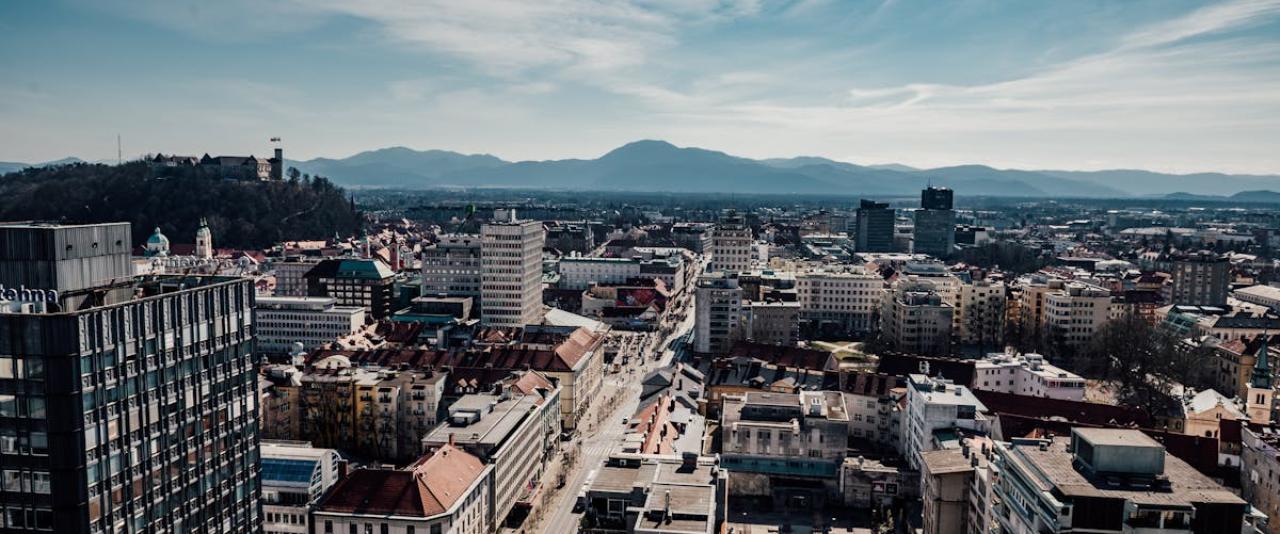 Free A stunning aerial view of Ljubljana, Slovenia featuring the city's buildings, castle, and surrounding mountains. Stock Photo