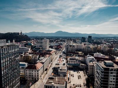 Free A stunning aerial view of Ljubljana, Slovenia featuring the city's buildings, castle, and surrounding mountains. Stock Photo