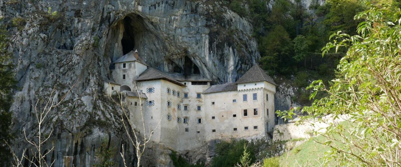 Free Discover the stunning Predjama Castle built into a cliffside cave in Slovenia. Stock Photo