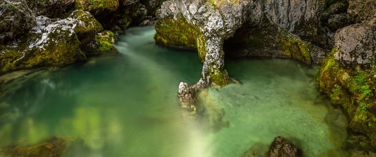 Free Discover the serene emerald pool in Slovenia's Mostnica Gorge. Tranquil and natural beauty. Stock Photo