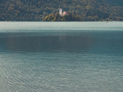 Tranquil lake scene with Church of the Assumption on Bled Island, Slovenia.