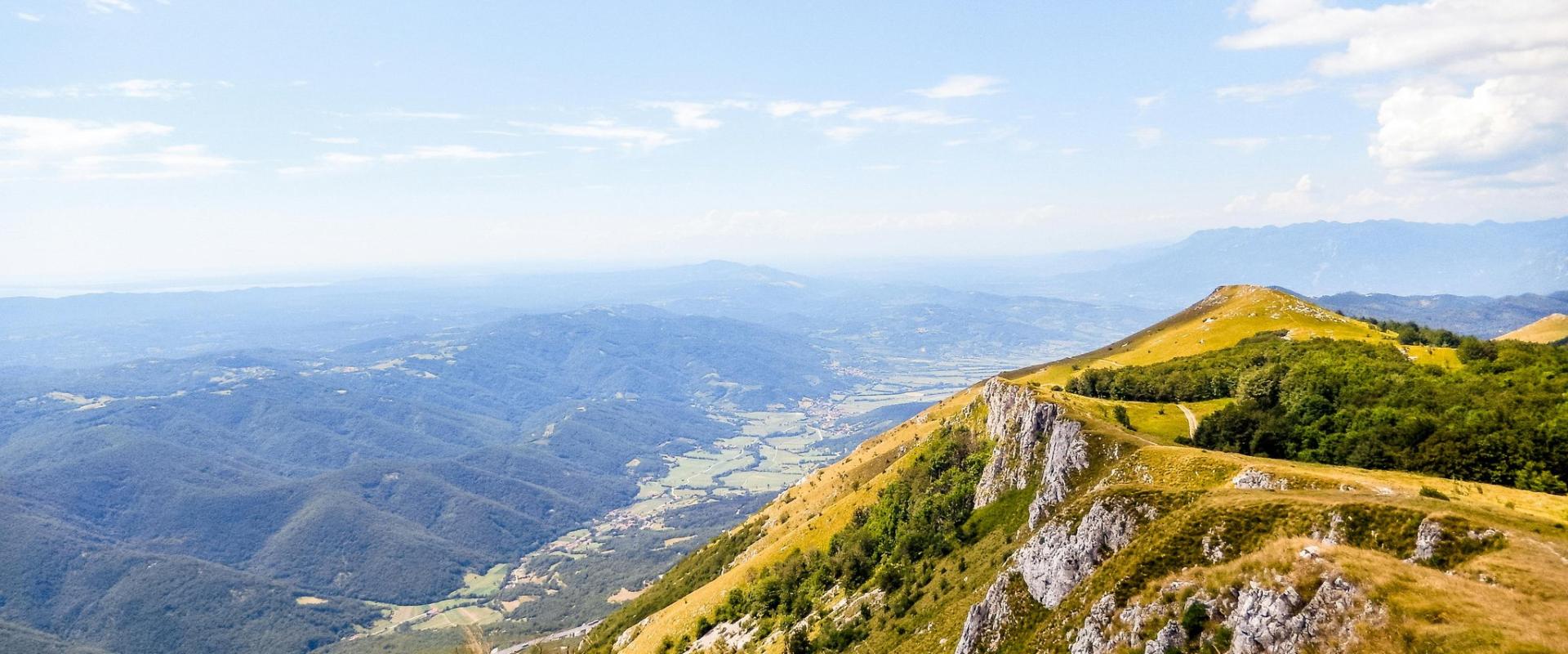Explore the stunning alpine landscapes of Ajdovščina, Slovenia, showcasing lush greenery and rocky terrain.