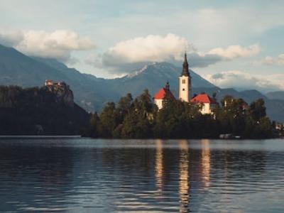 Free Idyllic landscape capturing Lake Bled with the Pilgrimage Church on Bled Island. Stock Photo