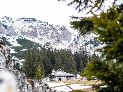 a view of a mountain with a house in the foreground
