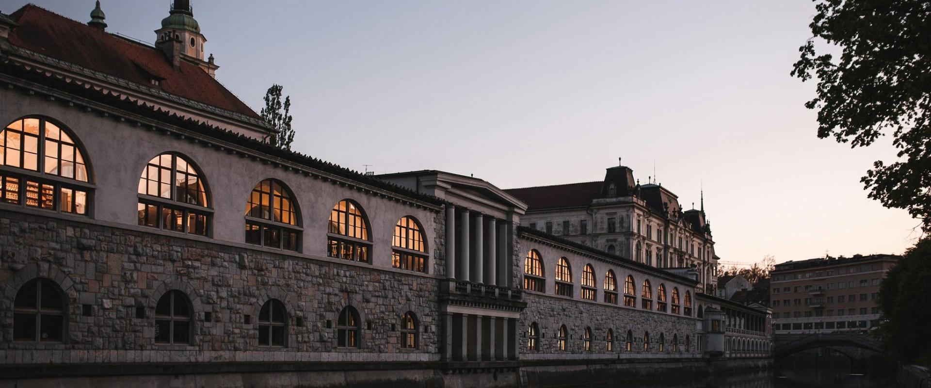 a large building sitting next to a body of water