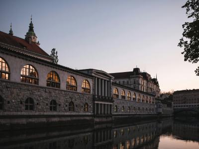 a large building sitting next to a body of water