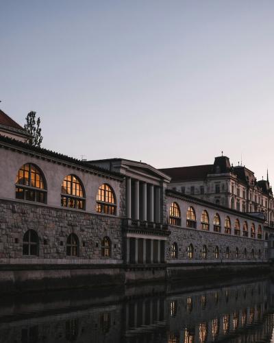 a large building sitting next to a body of water