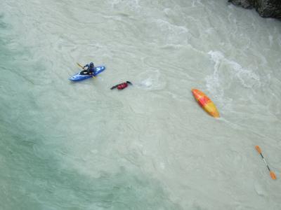 Overturned canoe in river Soča