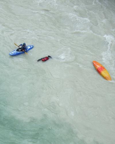 Overturned canoe in river Soča