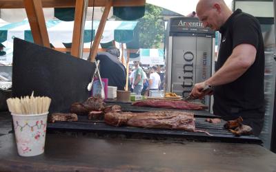 A cook grilling at the Odprta kuhna street-food market in Ljubljana