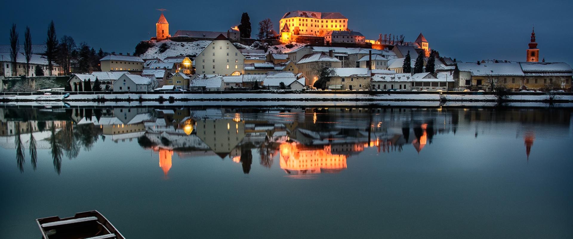 Ptuj and its hilltop castle reflected in the Drava River in the early morning, Štajerska