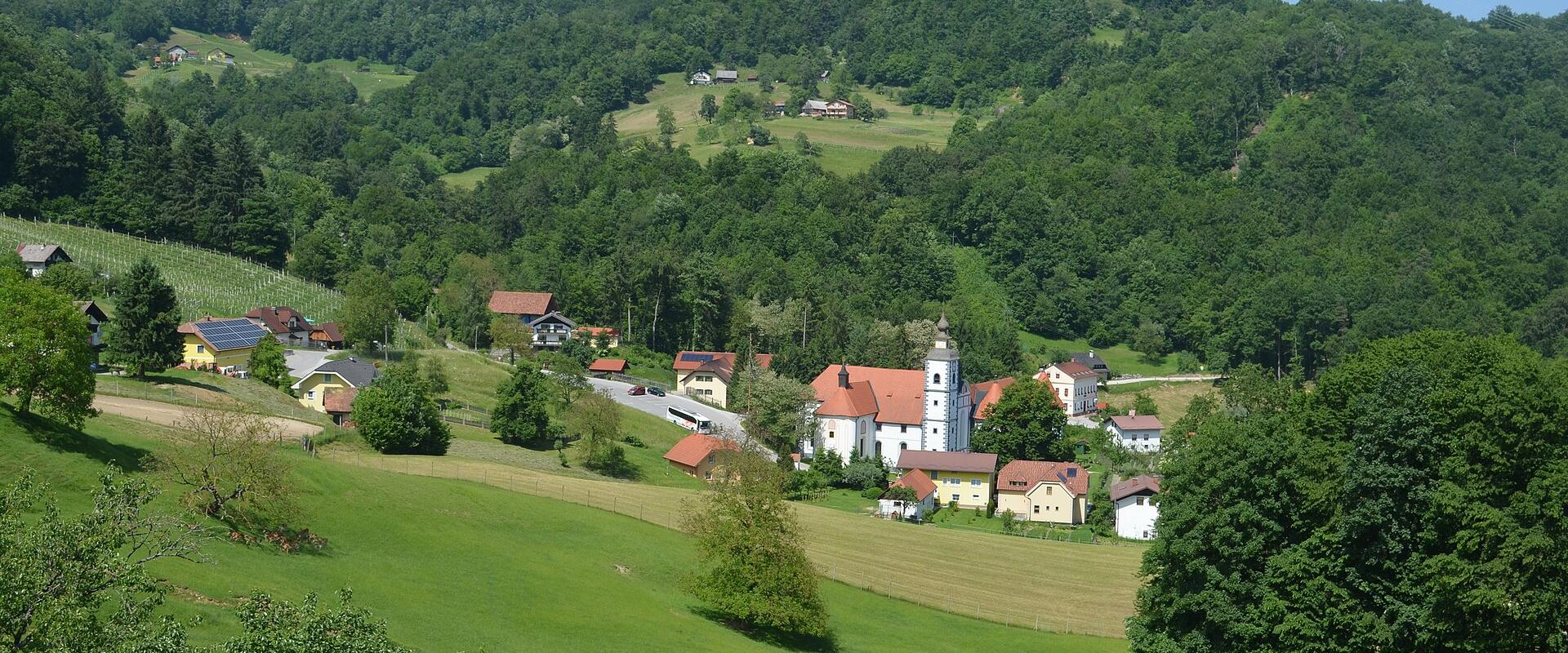 Green hills and village of Olimje, home of Jelenov greben