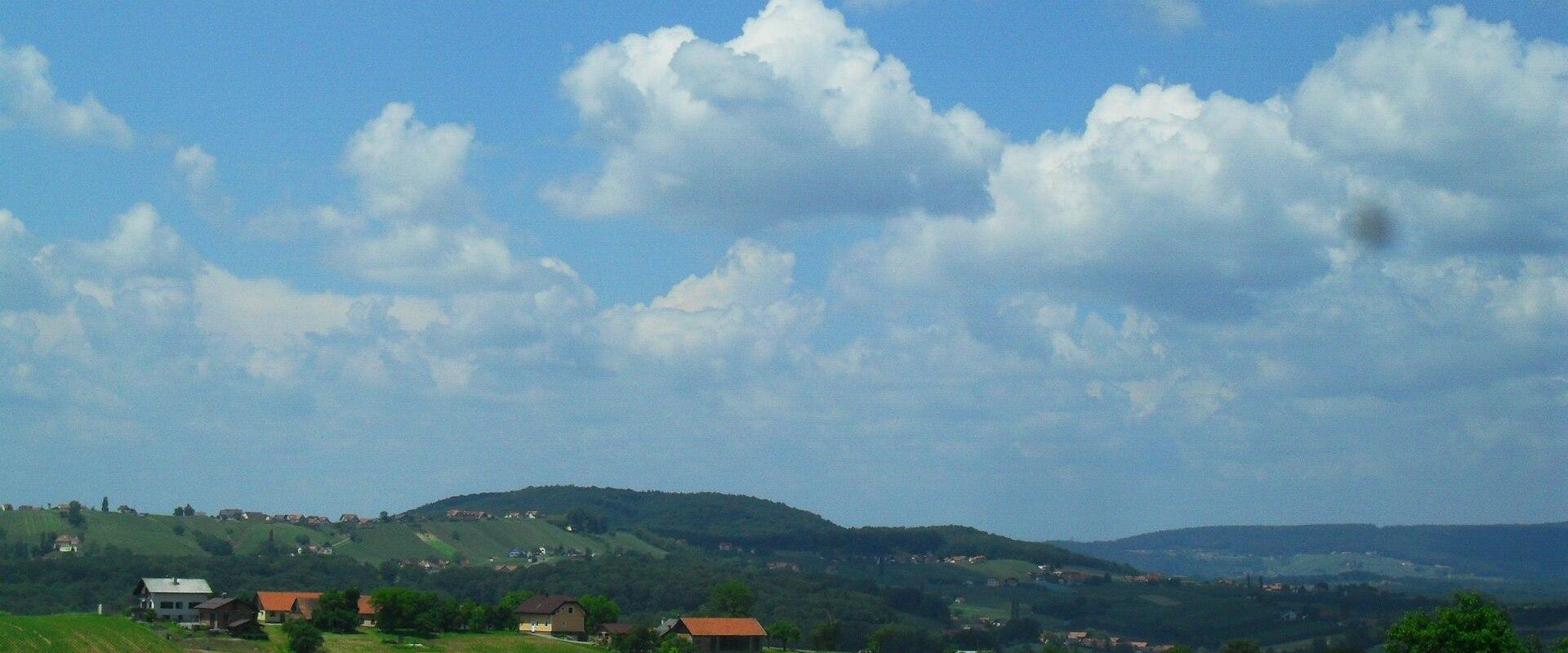 Rolling Goricko farmland under a big sky, the characteristic Prekmurje landscape.