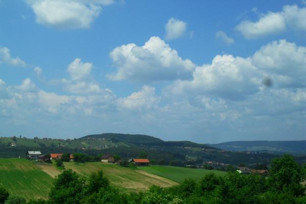 Rolling Goricko farmland under a big sky, the characteristic Prekmurje landscape.