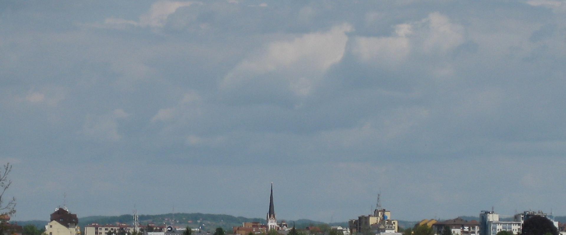Flowering fields and the skyline of Murska Sobota on the Pomurje plain