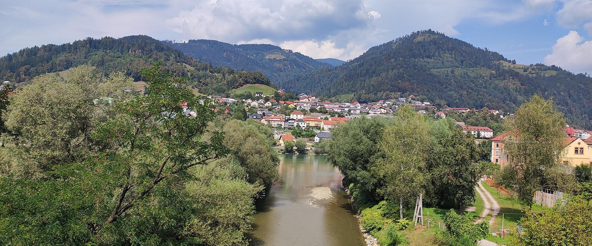 Dravograd at the confluence of the Drava and Meža beneath forested hills