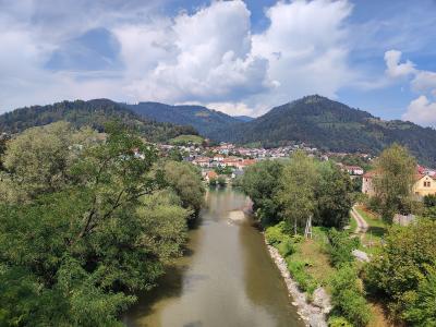 Dravograd at the confluence of the Drava and Meža beneath forested hills