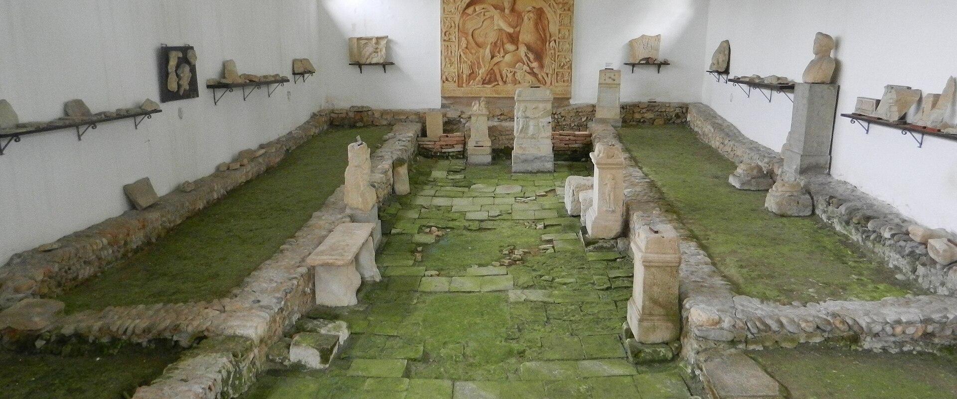 The excavated Mithraeum in Ptuj with its relief of Mithras