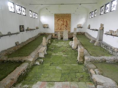 The excavated Mithraeum in Ptuj with its relief of Mithras