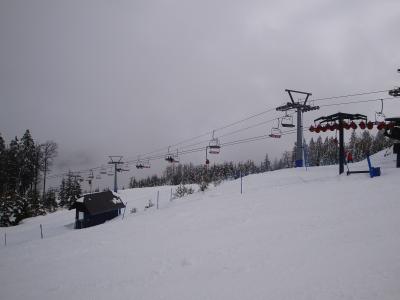 A chairlift and pistes on Rogla