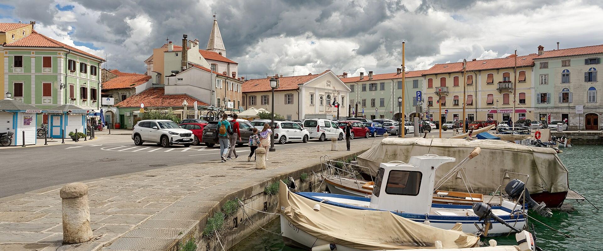 Fishing boats in the old harbour of Izola