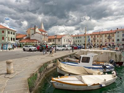 Fishing boats in the old harbour of Izola