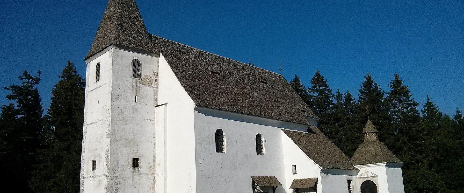 The white pilgrimage church of Sveti Areh in the Pohorje forests