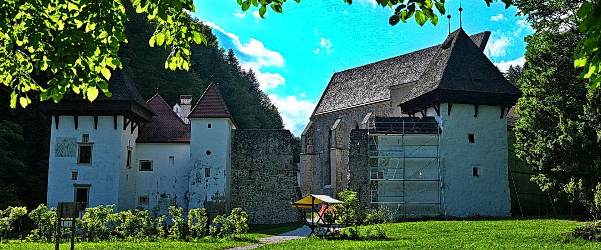 The buildings of Žiče Charterhouse (Žička kartuzija) in a green valley