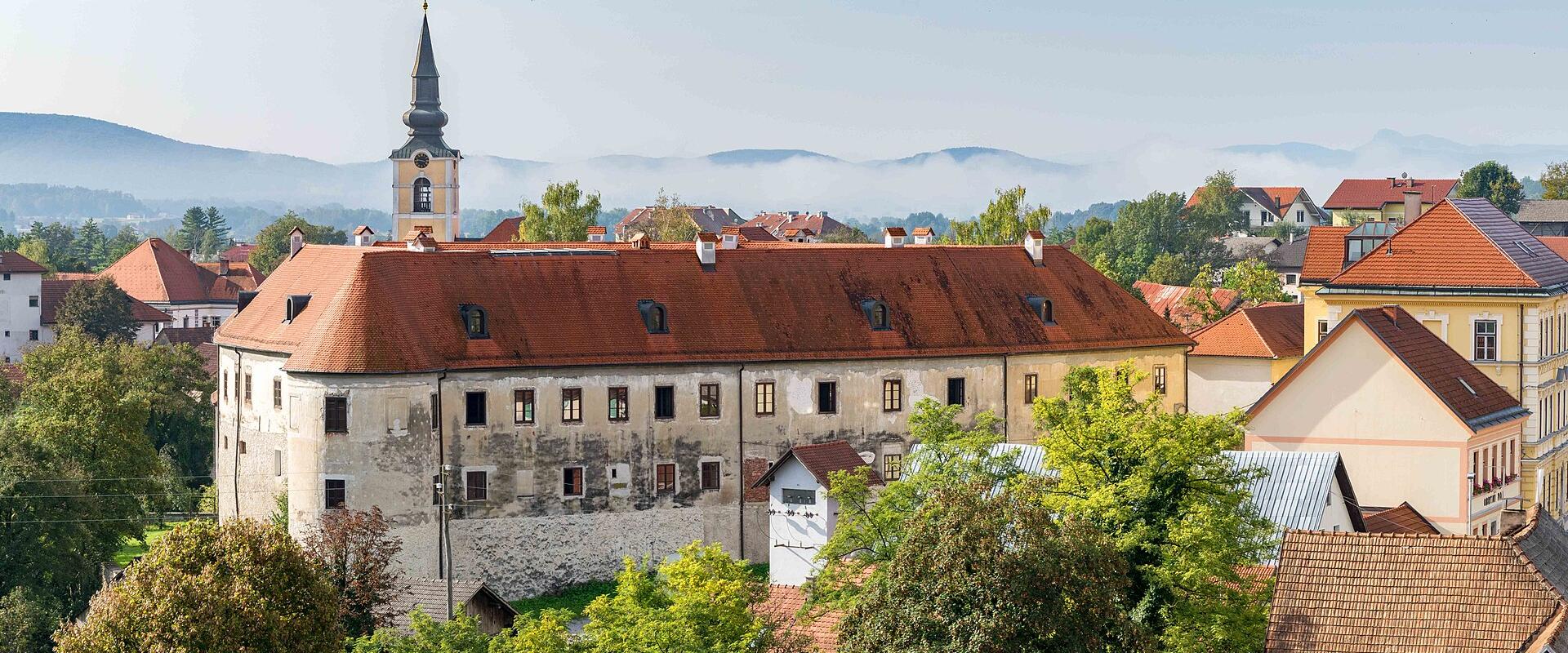 Metlika castle and the town church tower