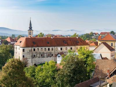 Metlika castle and the town church tower