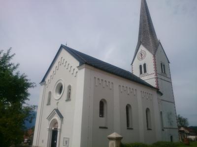 The white parish church of Šentanel in Koroška