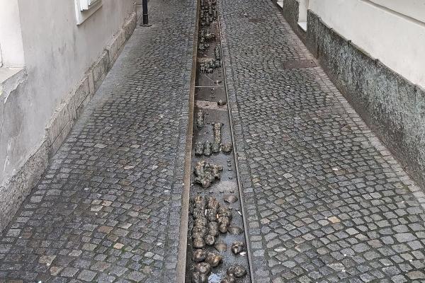 Trough Of 700 Bronze Faces