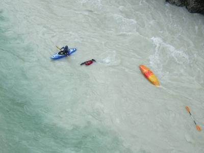 Overturned canoe in river Soča