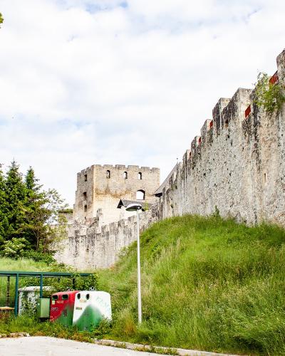 The walls of Celje's Old Castle climbing the hillside
