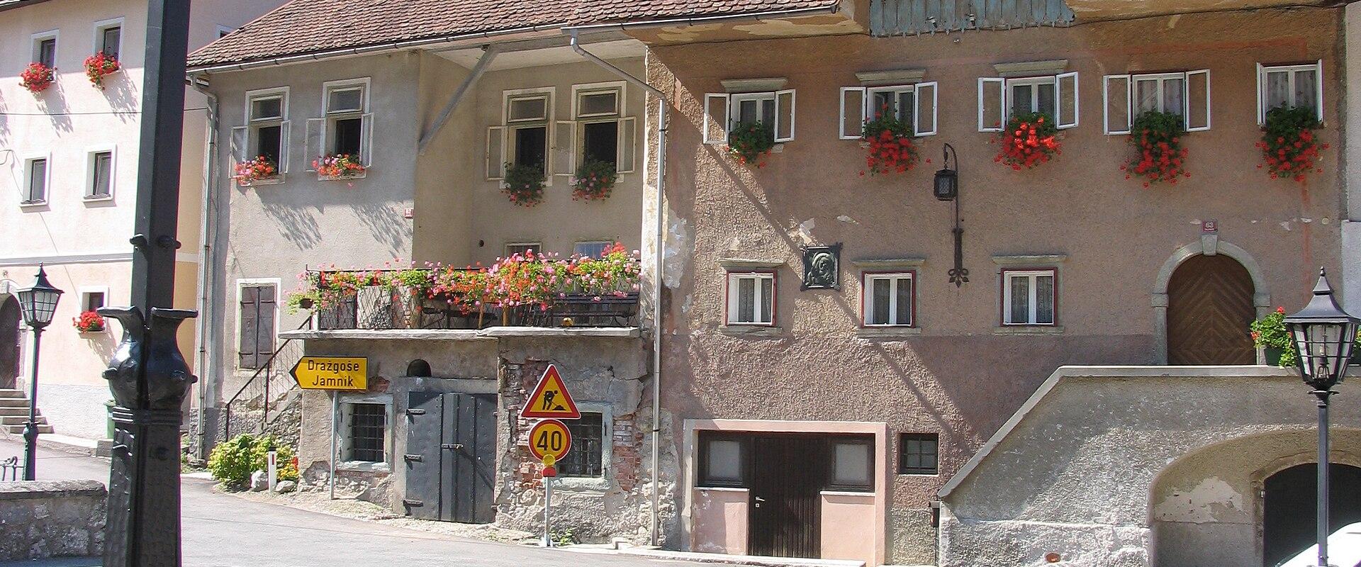 Kropa's old ironmasters' houses by the stream bridge