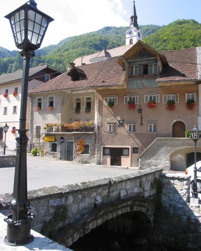 Kropa's old ironmasters' houses by the stream bridge