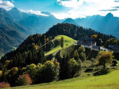 Green pastures below the Kamnik–Savinja Alps around Solčava
